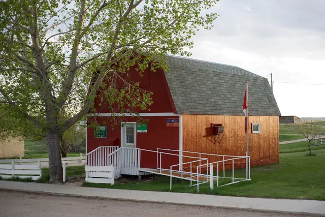 The Admiral post office, a red gambrel-roofed building